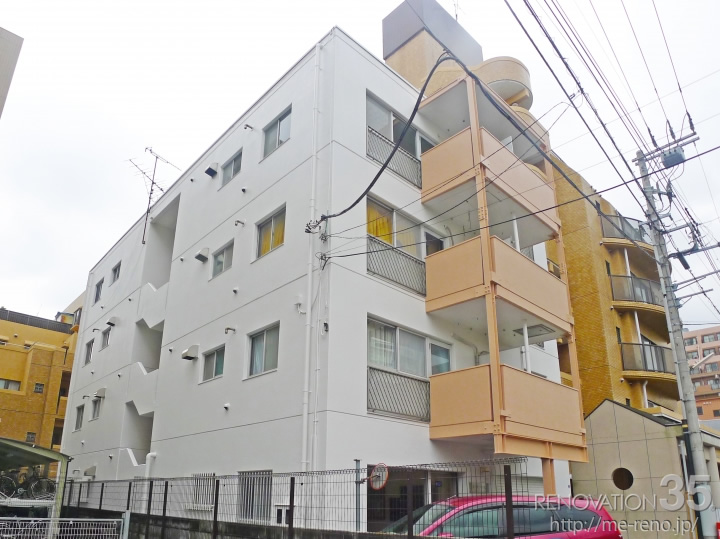 神奈川県平塚市のRC造4階建外壁リノベーション施工事例、ホワイト×パステルオレンジ